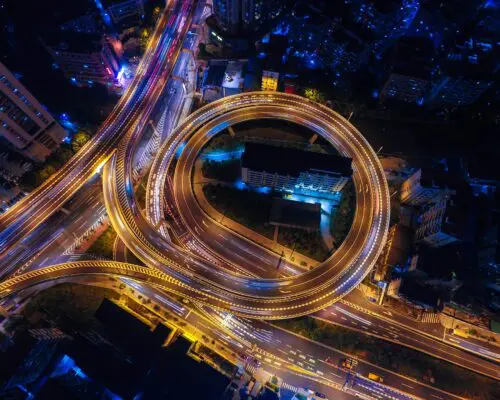 freeway intersection from overhead at night