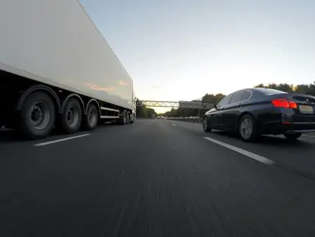 car driving by truck