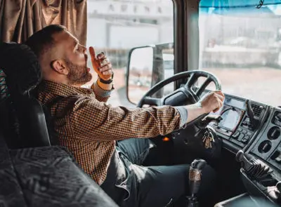 trucker driving and yawning