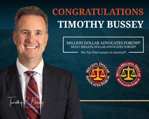 Portrait of attorney Timothy Bussey with text congratulating him for membership in the Million Dollar Advocates Forum and Multi-Million Dollar Advocates Forum, recognizing top trial lawyers in America.