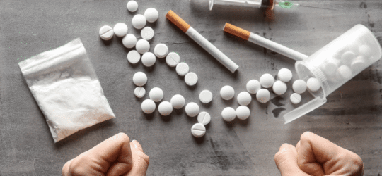 Pills, cigarettes, a bag of powder, and a syringe