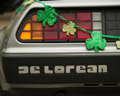 DeLorean car with shamrocks across the bumper.