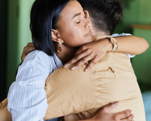 Two people hugging to console each other