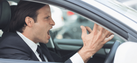 Road rage man in the drivers seat.