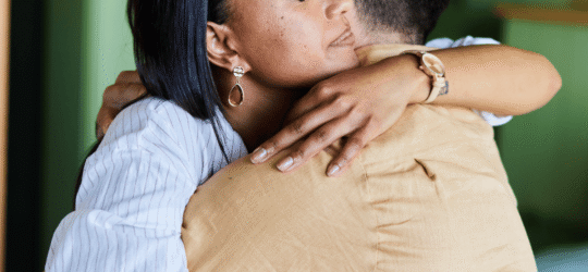 Two people hugging to console each other